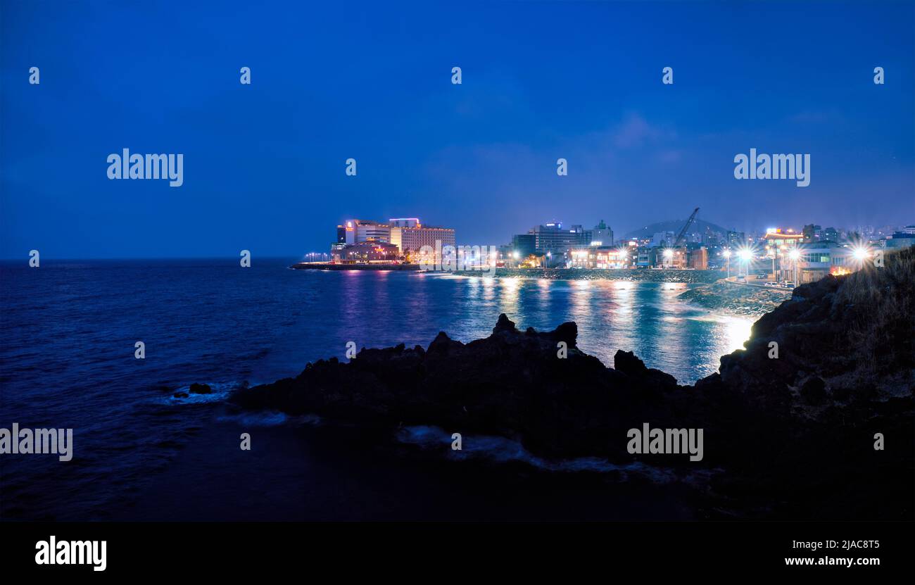 Jeju resort town illuminated in night, Jeju island, South Korea Stock