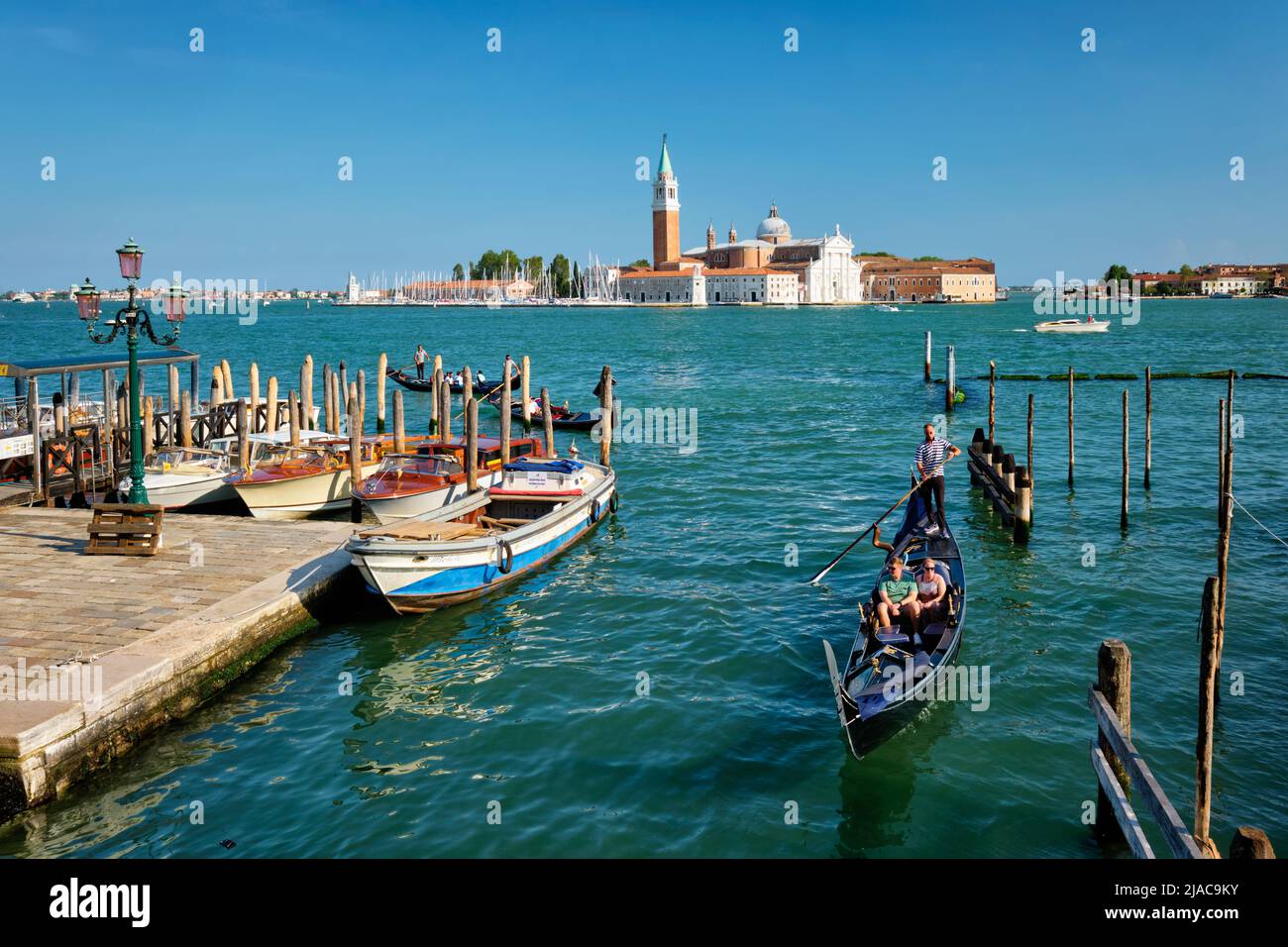 Gondolas in lagoon of Venice by Saint Mark San Marco square Stock Photo