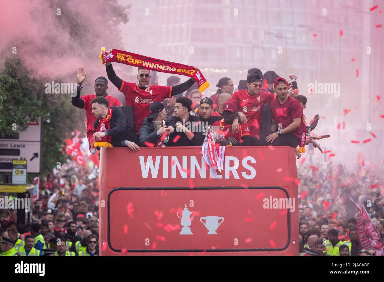 The Liverpool FC squad celebrate during the open top bus parade through