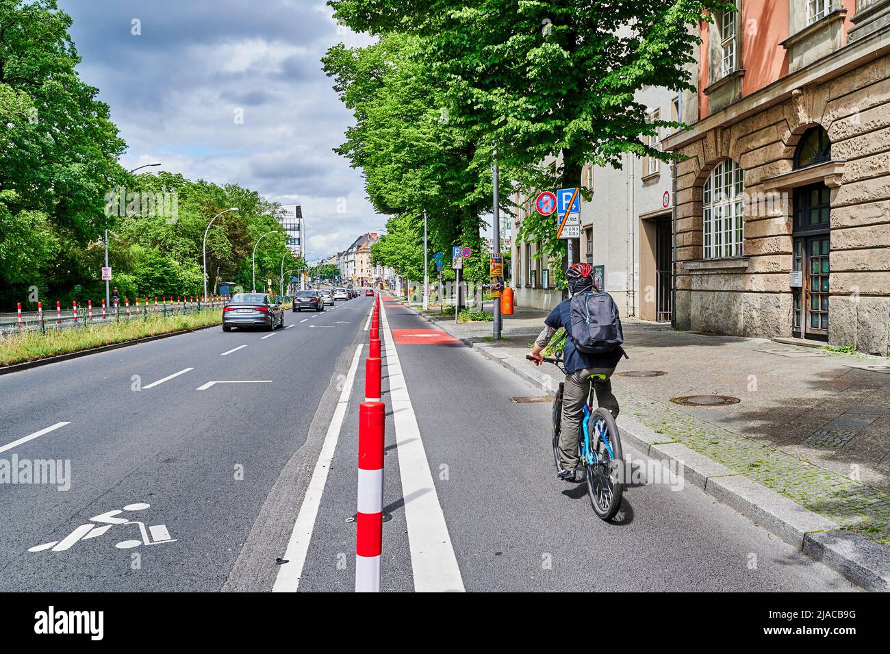 Berlin, Germany - May 29, 2022: Cyclist in a dedicated cycle lane on a ...