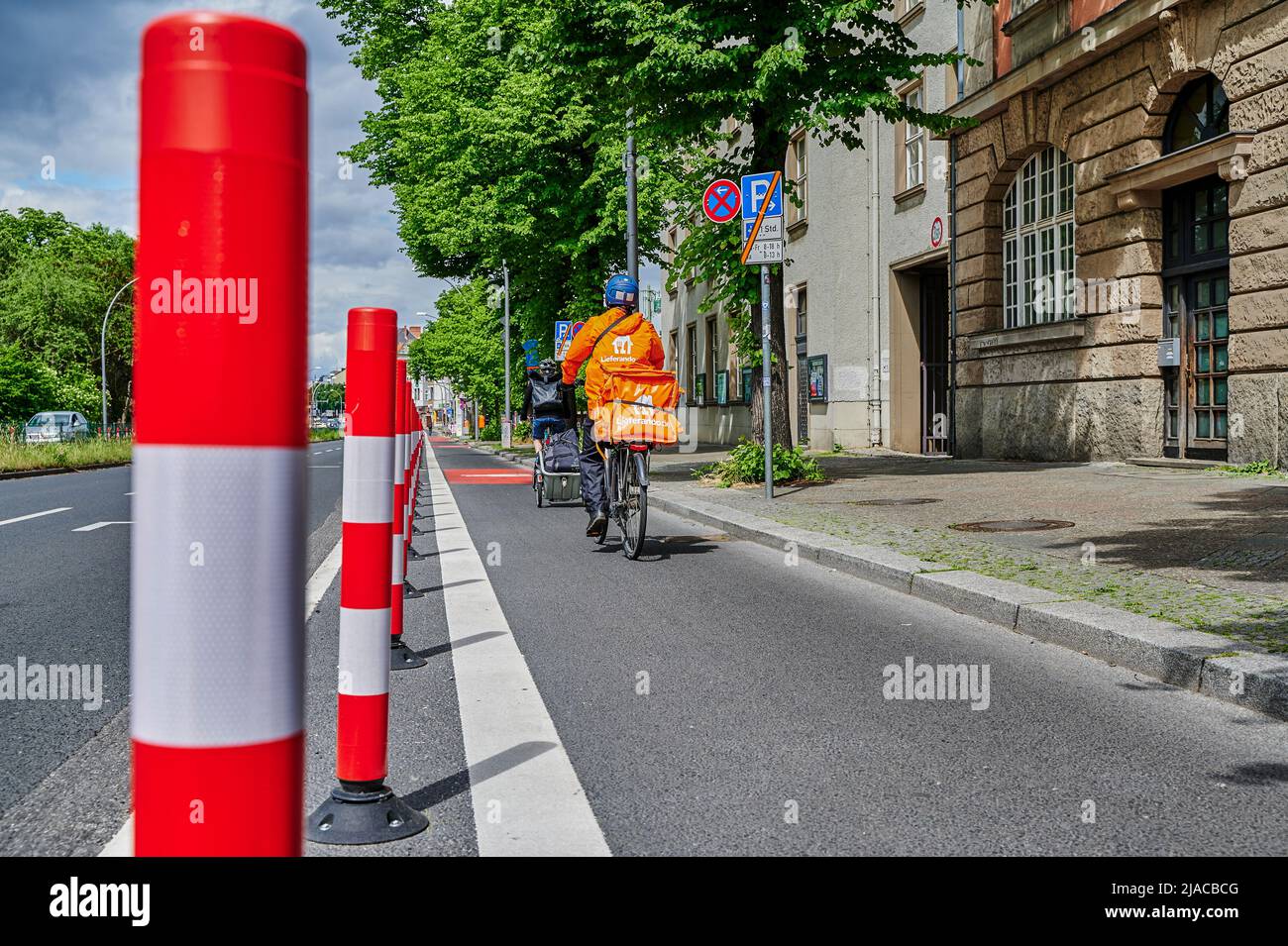 Berlin, Germany - May 29, 2022: Cyclists in a dedicated cycle lane on a ...