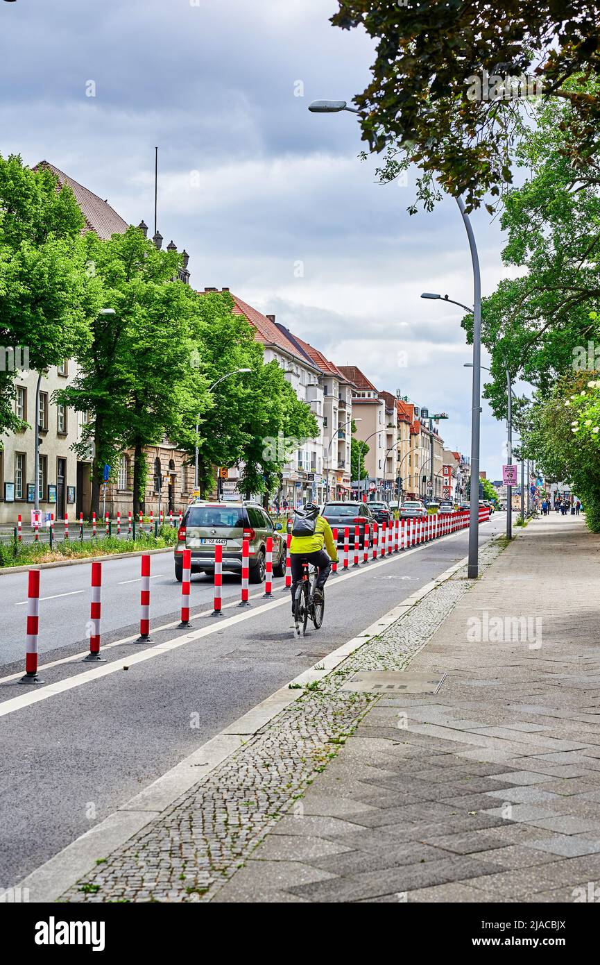 Berlin, Germany - May 29, 2022: Cyclist in a dedicated cycle lane on a ...