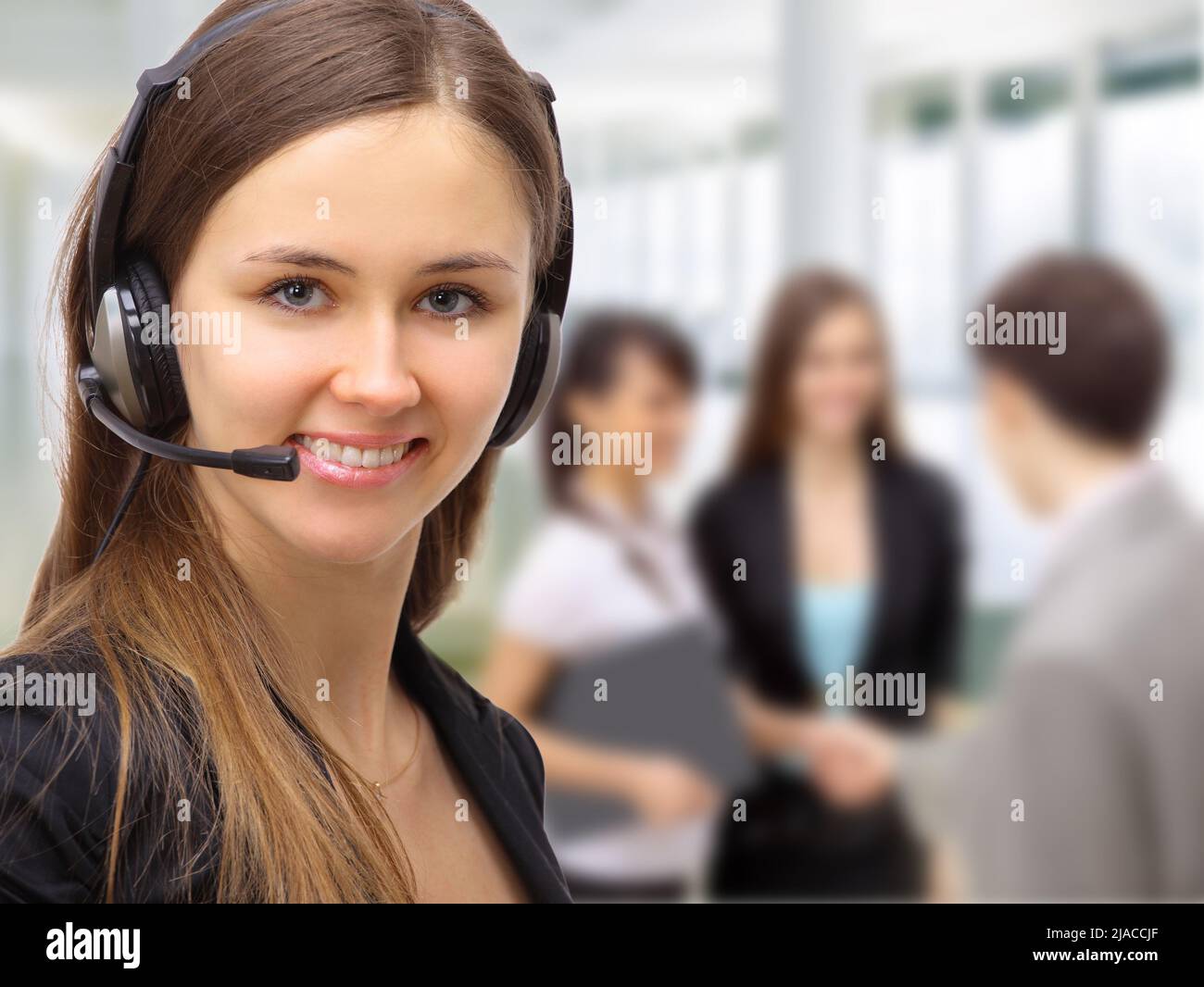 Friendly customer service consultants working Stock Photo - Alamy
