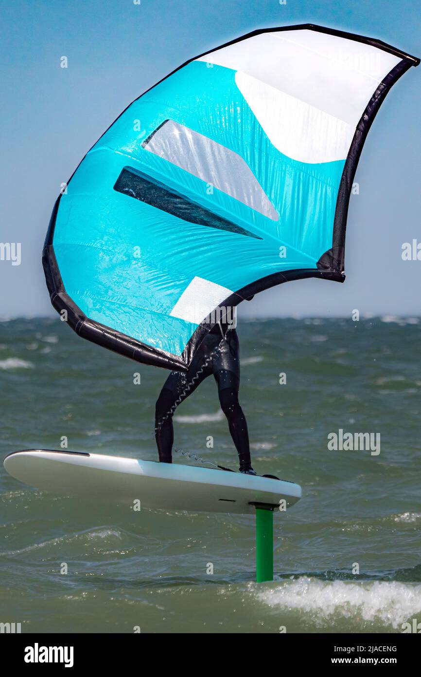 Close-up of a Wing Foil surfer on the sea Stock Photo