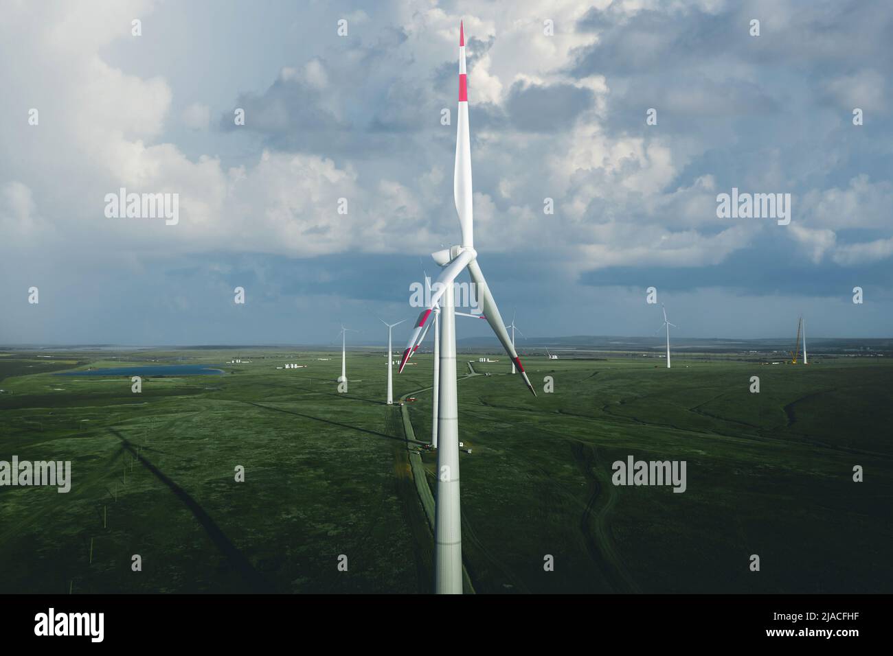 Wind Turbines Windmill Energy Farm with blue sky Stock Photo - Alamy