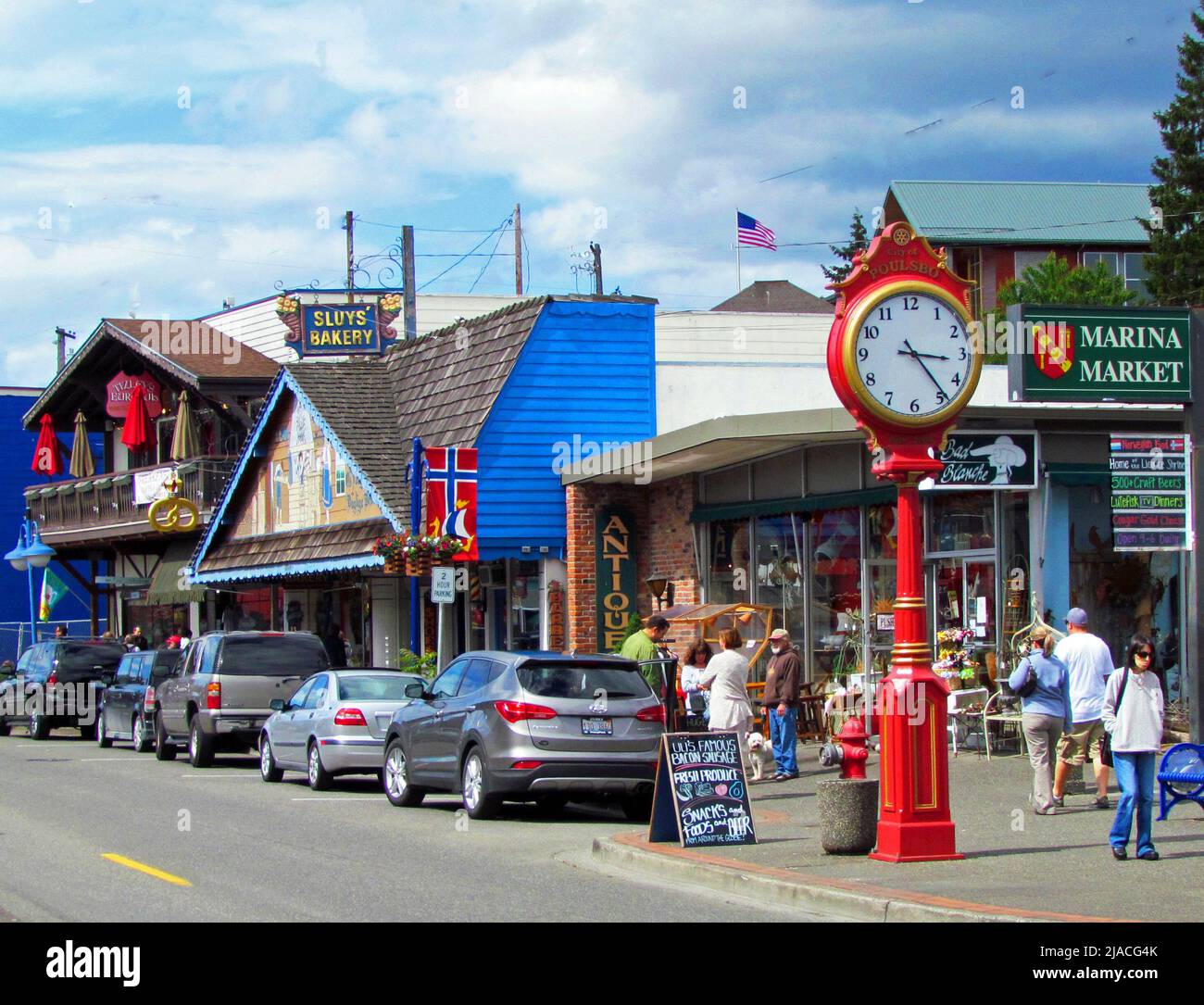 Street scene of Poulsbo, Washington showing shops and city clock with