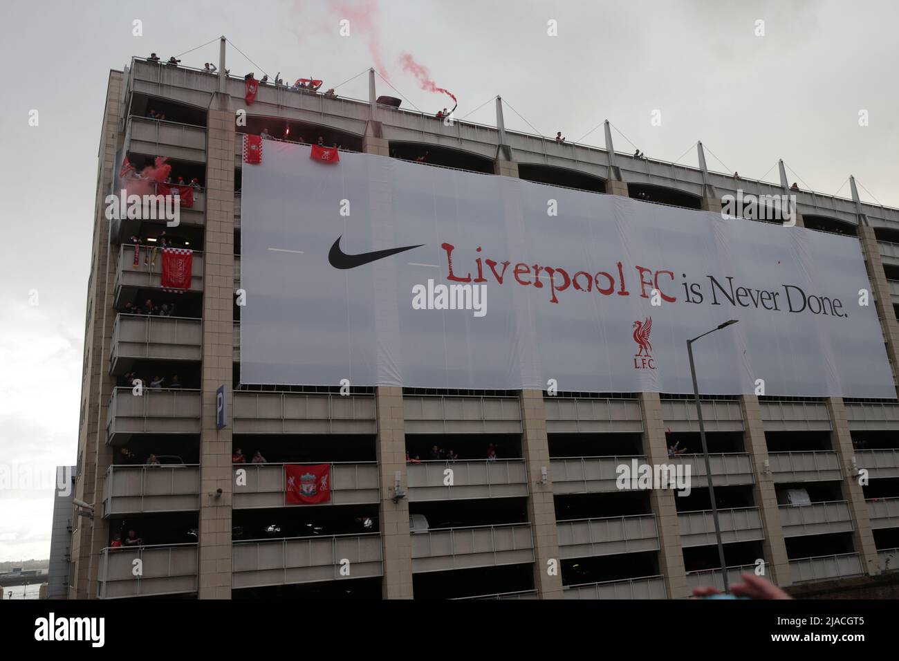 Liverpool, Merseyside, UK. 29th May, 2022. Liverpool FC 2021-22 Victory Parade; fans look on from above a giant Nike banner on the upper levels of a multi storey car park Credit: Action Plus Sports/Alamy Live News Stock Photo