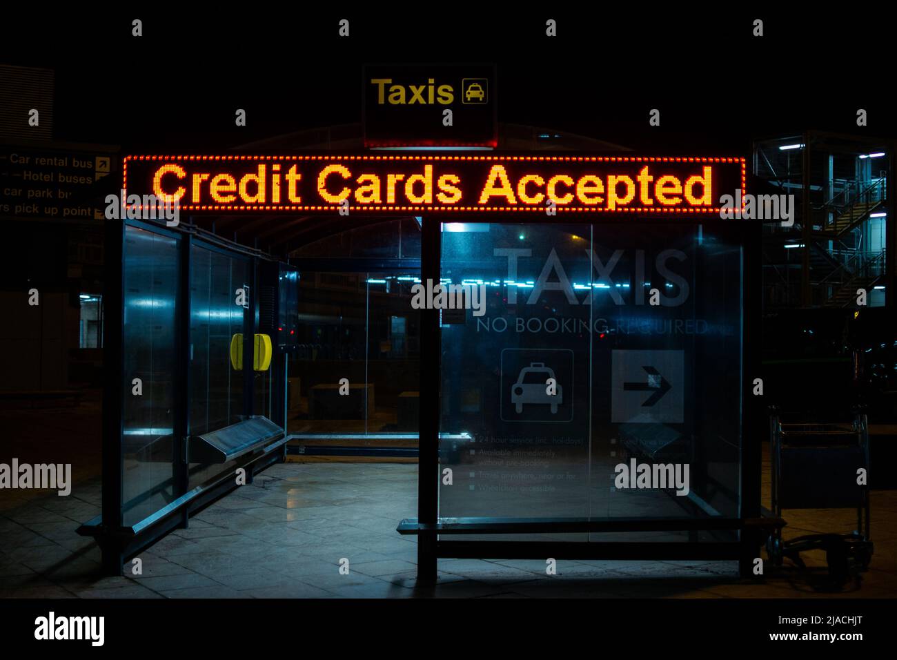 Taxi shelter stating 'Credit Cars Accepted' in Manchester International Airport, Greater Manchester, united Kingdom. Stock Photo