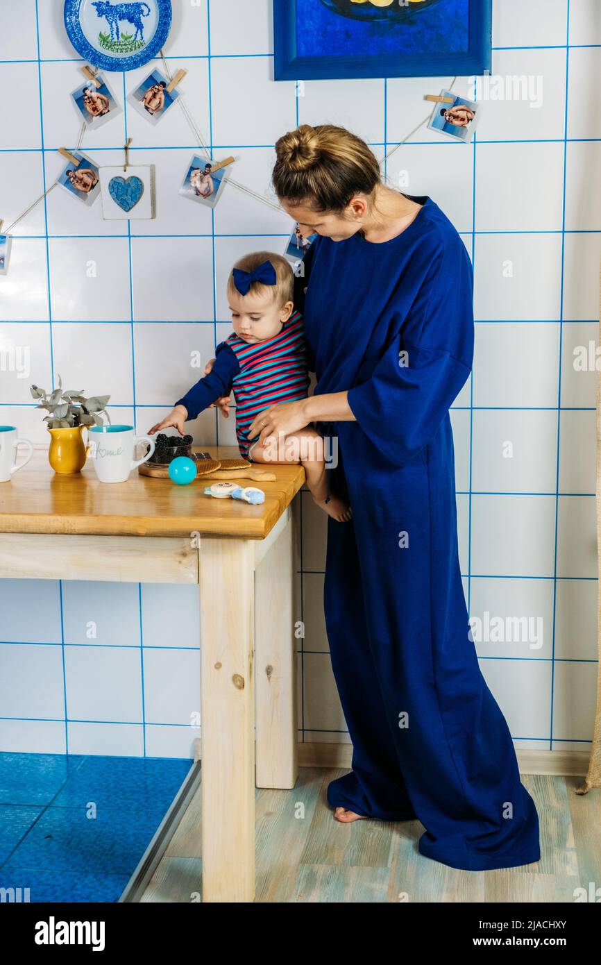 The first fruits and berries for babies. Mother and baby toddler