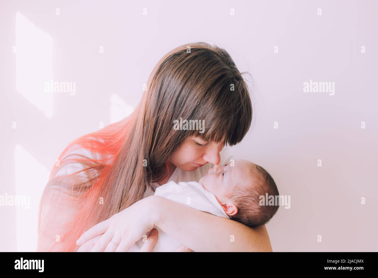 Mom holds the baby in her arms lifestyle . Mother's love for her son. A
