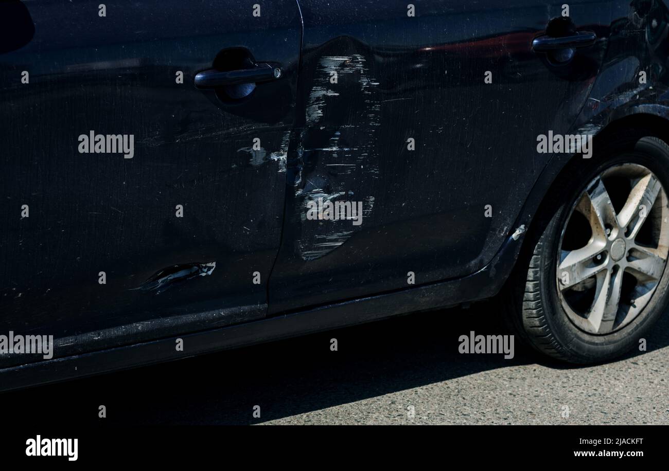 scratch and dent on the car. automobile accident. insurance Stock Photo