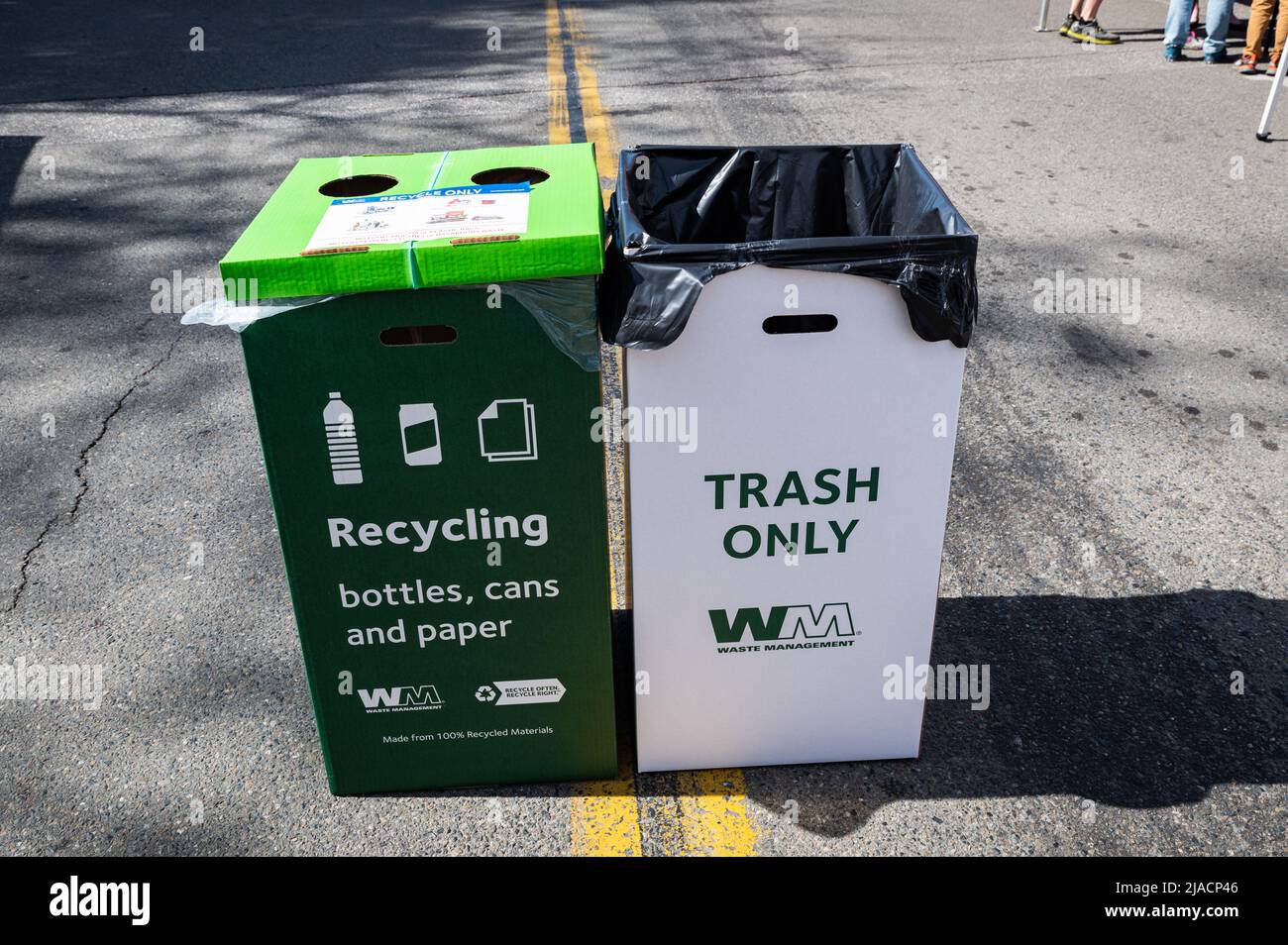 Photo of cardboard recycling and waste bins provided by Waste Management at a downtown Earthfest event. Stock Photo