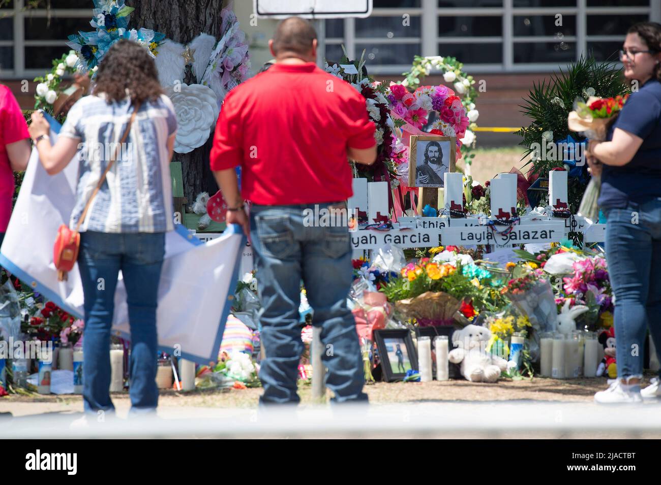 May 29, 2022: Crosses bear the names of the shooting victims at Robb Elementary School, makeshift memorial in Uvalde. Residents give their respects to the 19 children killed in the mass shooting. Uvalde, Texas. Mario Cantu/CSM. Stock Photo