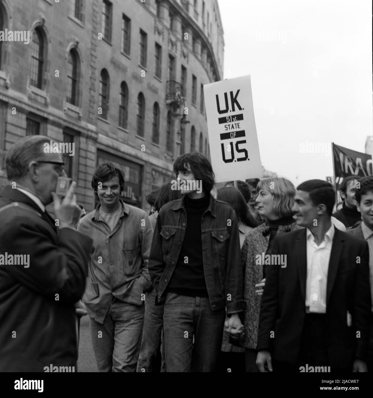 1960s beatniks marching through a London street during a protest against the Vietnam War in 1967 Stock Photo