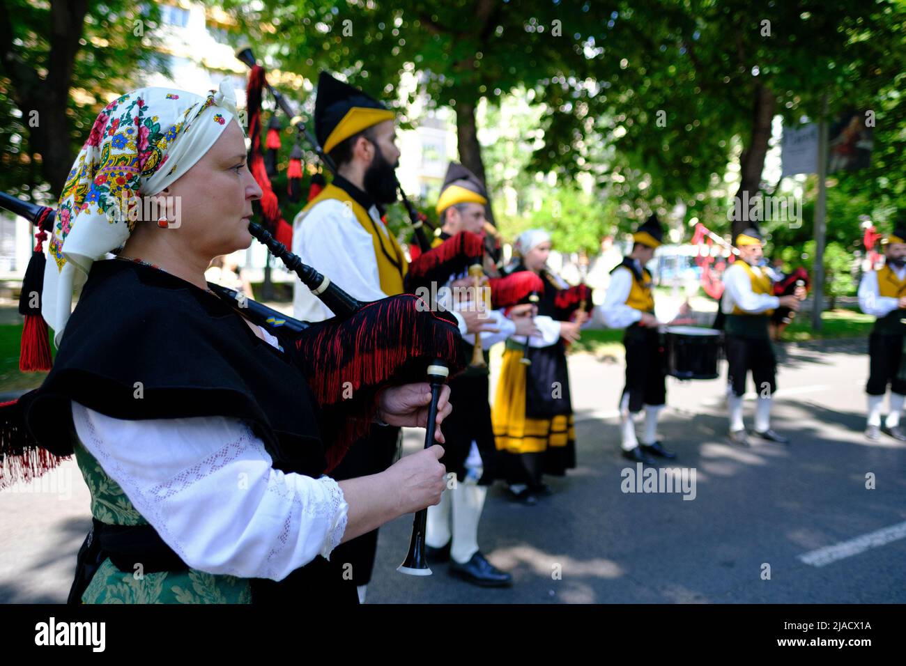 Madrid, Spain. 29th May, 2022. A woman dressed in traditional costume plays a bagpipe during the Dulzainas de la Villa festival at the Paseo del Prado in Madrid. The festival was organised by the ARARE association (Cultural Association of Music and Dance) for the dissemination of cultural traditions of Spain. Credit: SOPA Images Limited/Alamy Live News Stock Photo