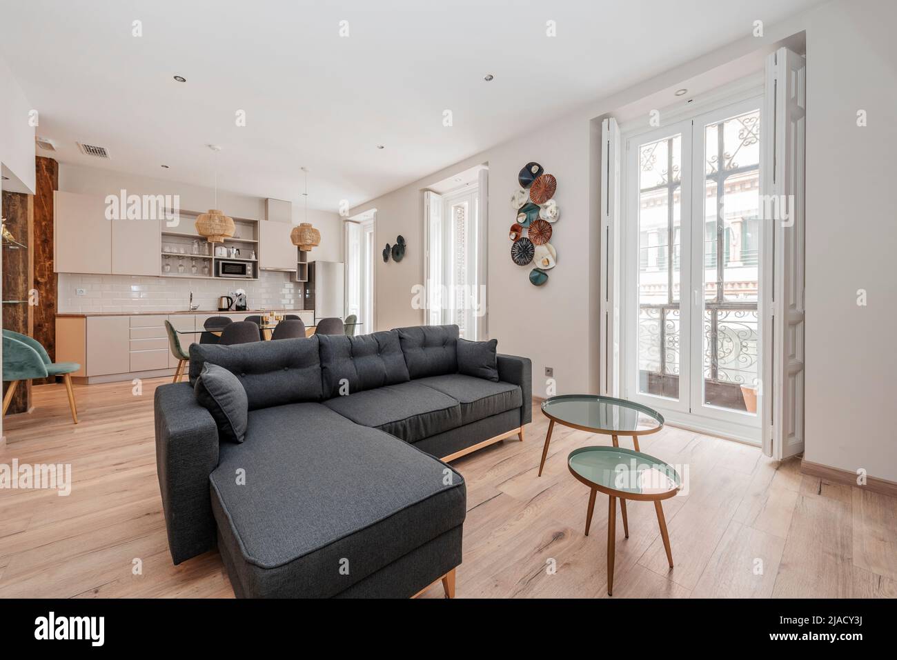 Living room with sofa upholstered in blue fabric with chaise longue
