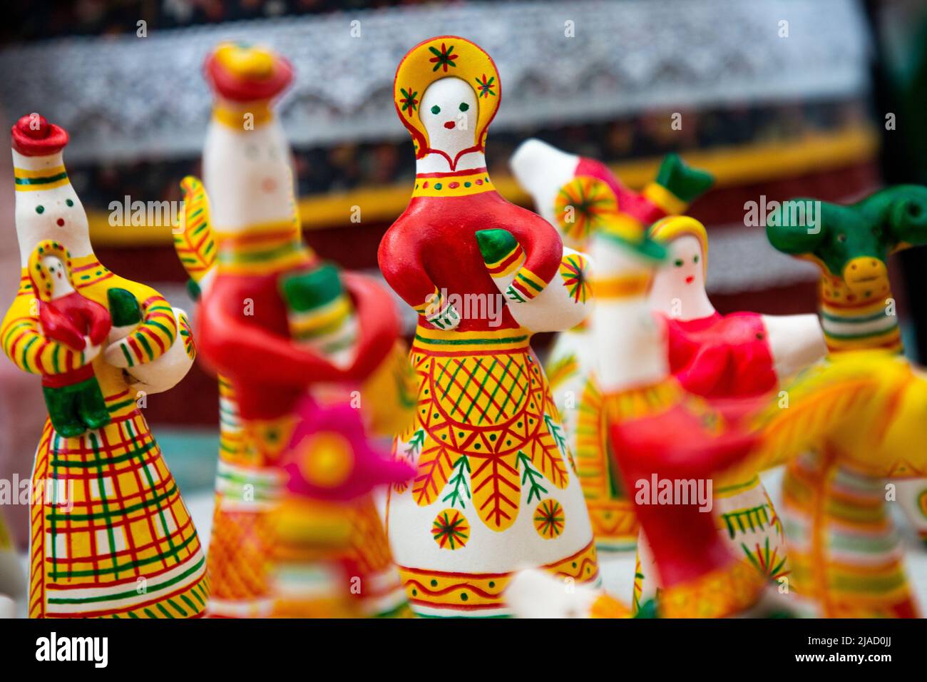 A counter with brightly coloured Filimonov ceramic toys from Tula region in Russia Stock Photo
