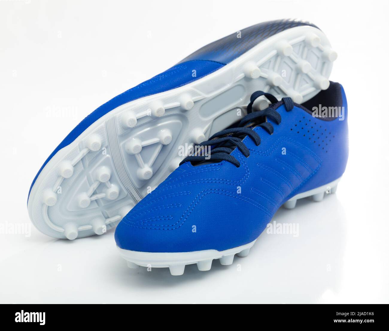 Football boots with studs isolated on white background Stock Photo - Alamy