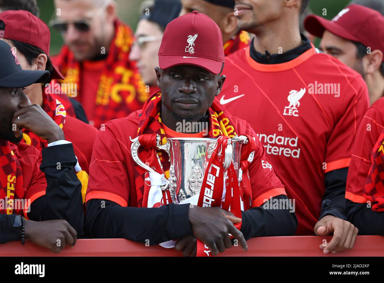 Liverpool, UK. 29th May, 2022. Sadio Mane of Liverpool looks deep in thought as he holds the Carabao Cup. Liverpool Football Club victory parade in Liverpool on Sunday 29th May 2022. Liverpool FC celebrate this season's mens and women's teams achievements with an open top bus parade around Liverpool. Editorial use only. pic by Chris Stading/Andrew Orchard sports photography/Alamy Live news Credit: Andrew Orchard sports photography/Alamy Live News Stock Photo