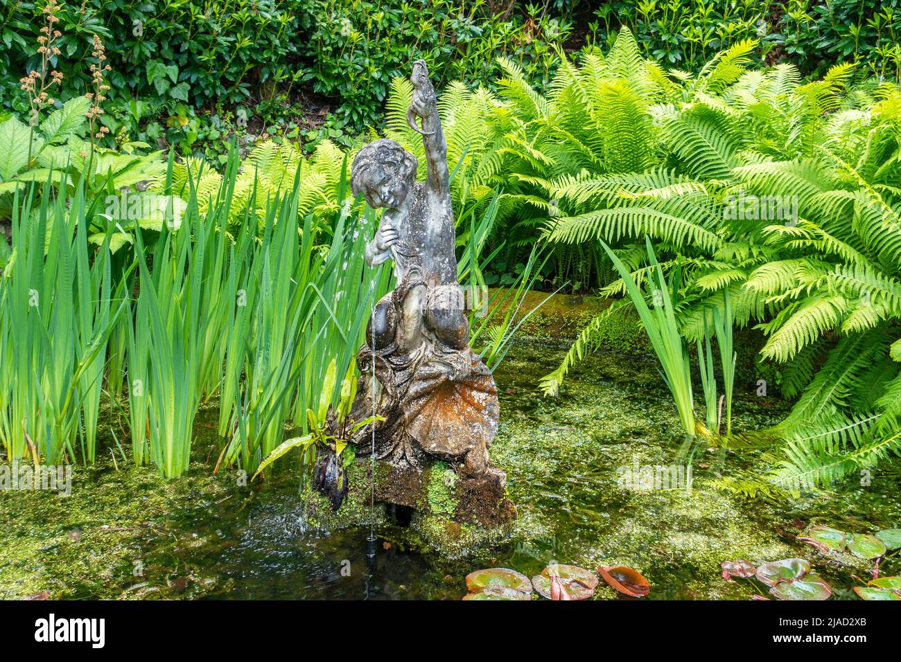 Statue in a pond and Fountain,Compton Acres,Poole,England Stock Photo