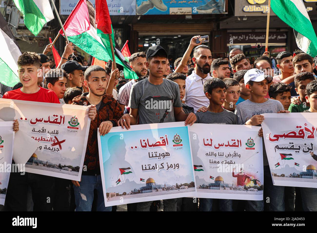 Gaza. 29th May, 2022. Palestinian people protest against the flag march in Jabalia, northern Gaza Strip, on May 29, 2022. Tens of thousands of Palestinians have joined public protests organized in the West Bank and the Gaza Strip against the flag march on Sunday. The controversial flag march through Jerusalem's Old City took place on Sunday to mark Jerusalem Day, which commemorates the unification of the city after Israel annexed East Jerusalem in 1967. Credit: Rizek Abdeljawad/Xinhua/Alamy Live News Stock Photo
