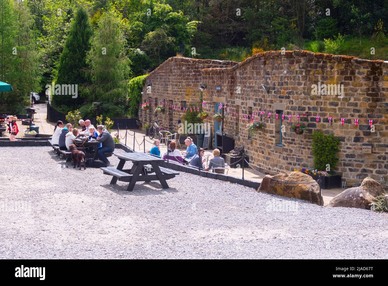 Customers at Lord Stones Café, prefering to eat outside rather than going inside the café Stock Photo