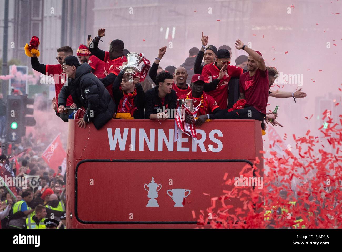 The Liverpool FC squad celebrate during the open top bus parade through