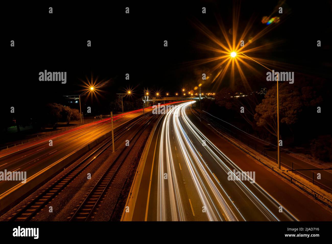 Light trails on a motorway at night, Perth, Western Australia, Australia Stock Photo