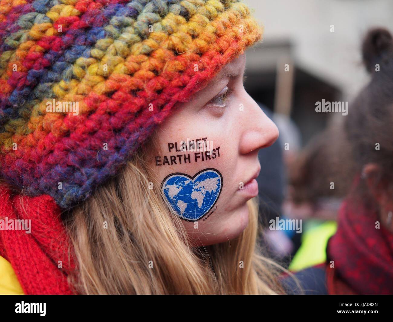 'Planet Earth First' written on a girl's face. With the motto 'keep coal in the ground' thousands of activists took to the streets demanding Climate Justice two days ahead of the United Nations Framework Convention on Climate Change - UNFCCC - COP23 Stock Photo
