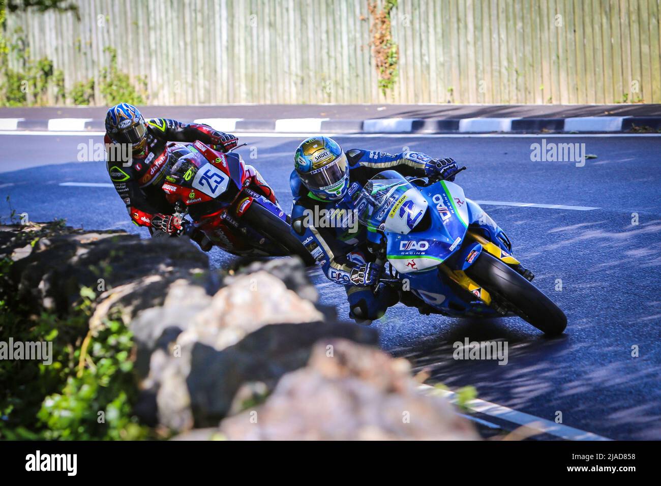 Dean Harrison on the DAO Racing Kawasaki followed by Rob Hodson during first practice for the 2022 Isle of Man TT races.  Close racing. Stock Photo