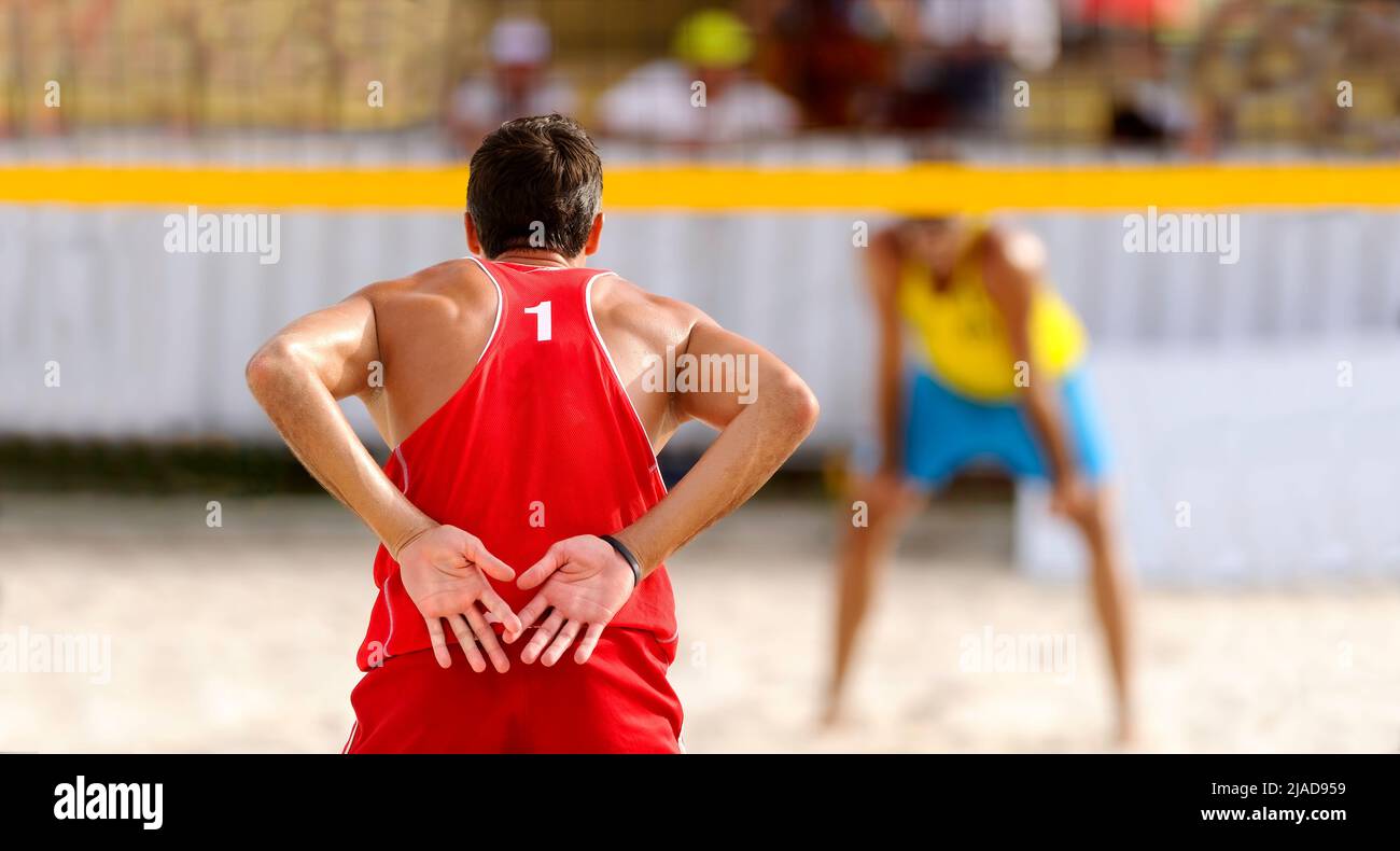 A Beach Volleyball Player Is Relaying Hand Signals To His Team Mate Stock Photo Alamy