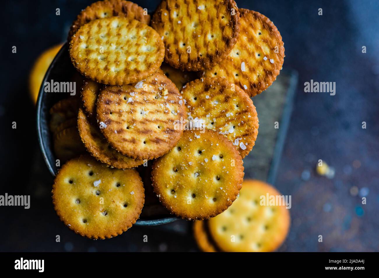 Overhead view of Salted cracker cookies in a metal bucket on a table