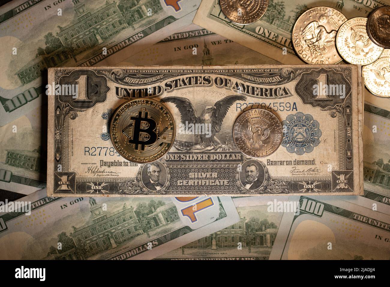 Bitcoin on rare one Dollar banknote. Raise US Dollar bill from other 100  USD banknotes. Cryptocurrency investment in future Stock Photo - Alamy