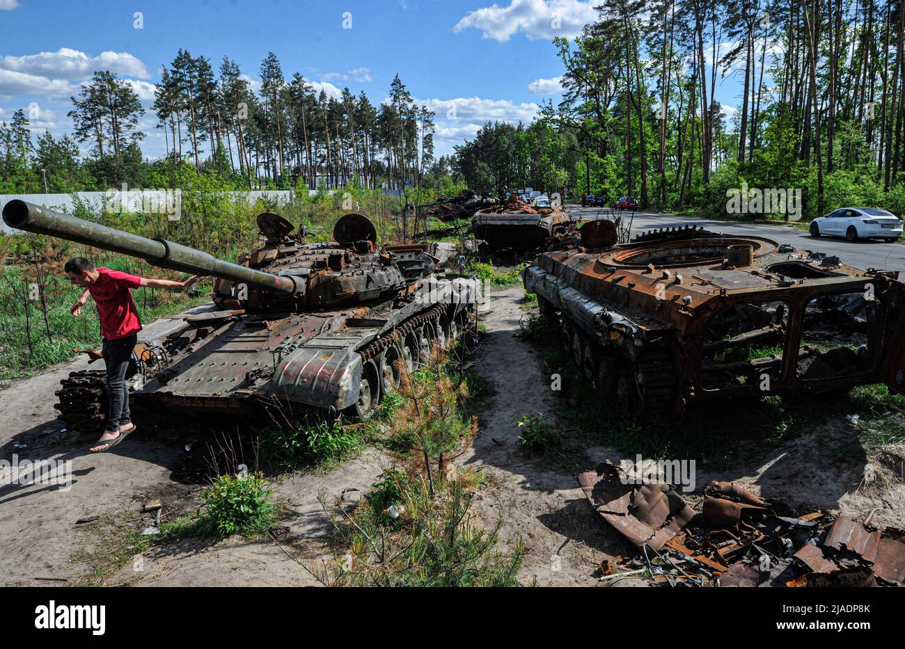 Dmytrivka, Ukraine. 29th May, 2022. A man looks at a destroyed Russian tank and armored vehicles at Dmytrivka village near the Ukrainian capital Kyiv. Russia invaded Ukraine on 24 February 2022, triggering the largest military attack in Europe since World War II. Credit: SOPA Images Limited/Alamy Live News Stock Photo