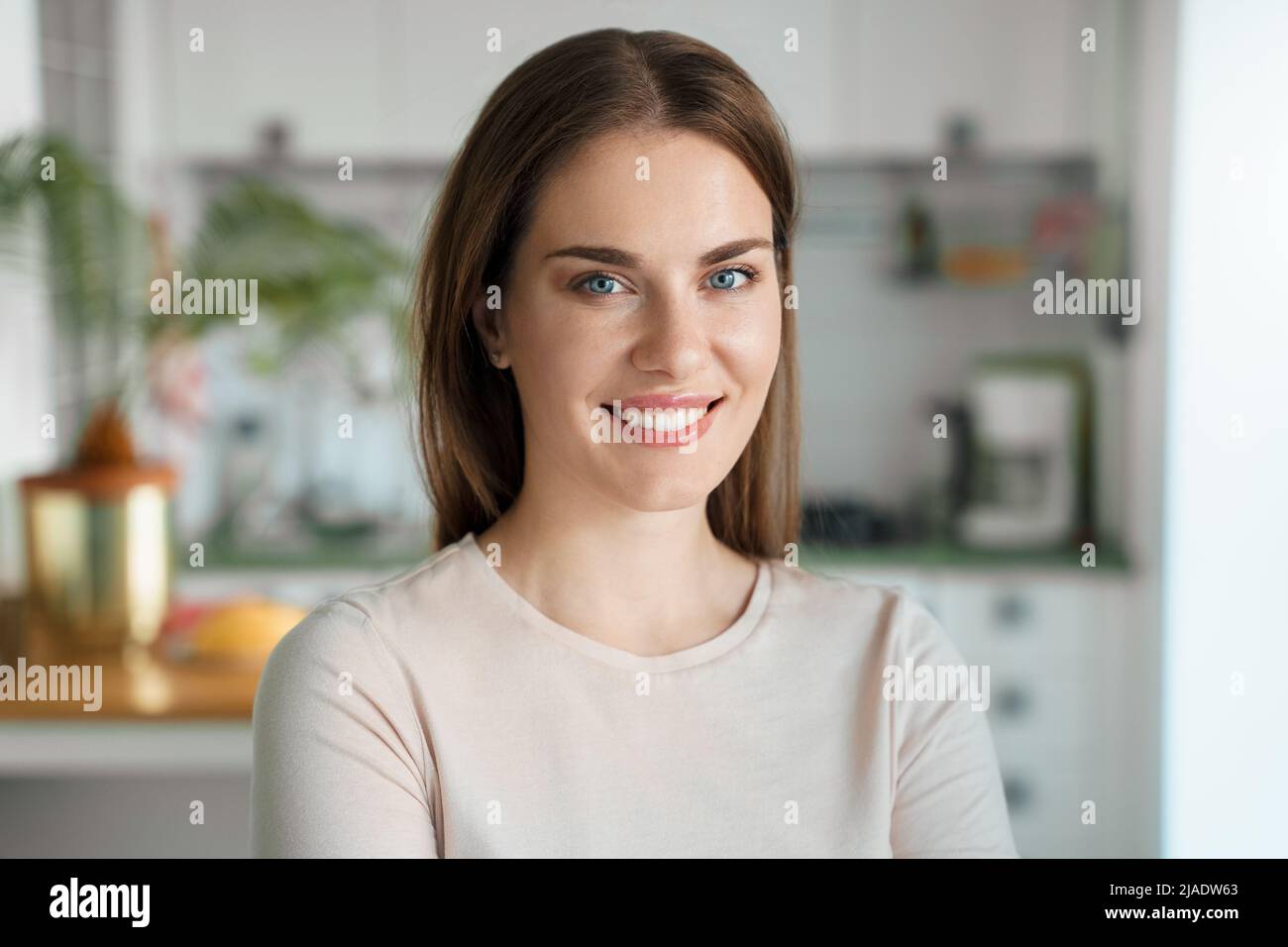 Portrait of young smiling woman at home office Stock Photo