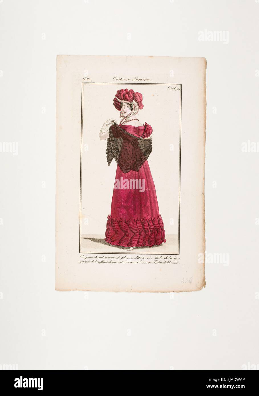 Fashion image: 'French lady with feather hat, red toilet and black top clamp'. Unknown Stock Photo