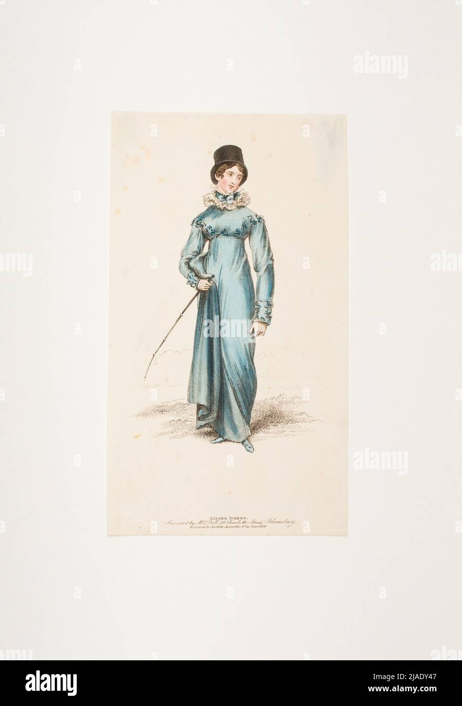Fashion image: a figure, ladies riding dress. Unknown Stock Photo