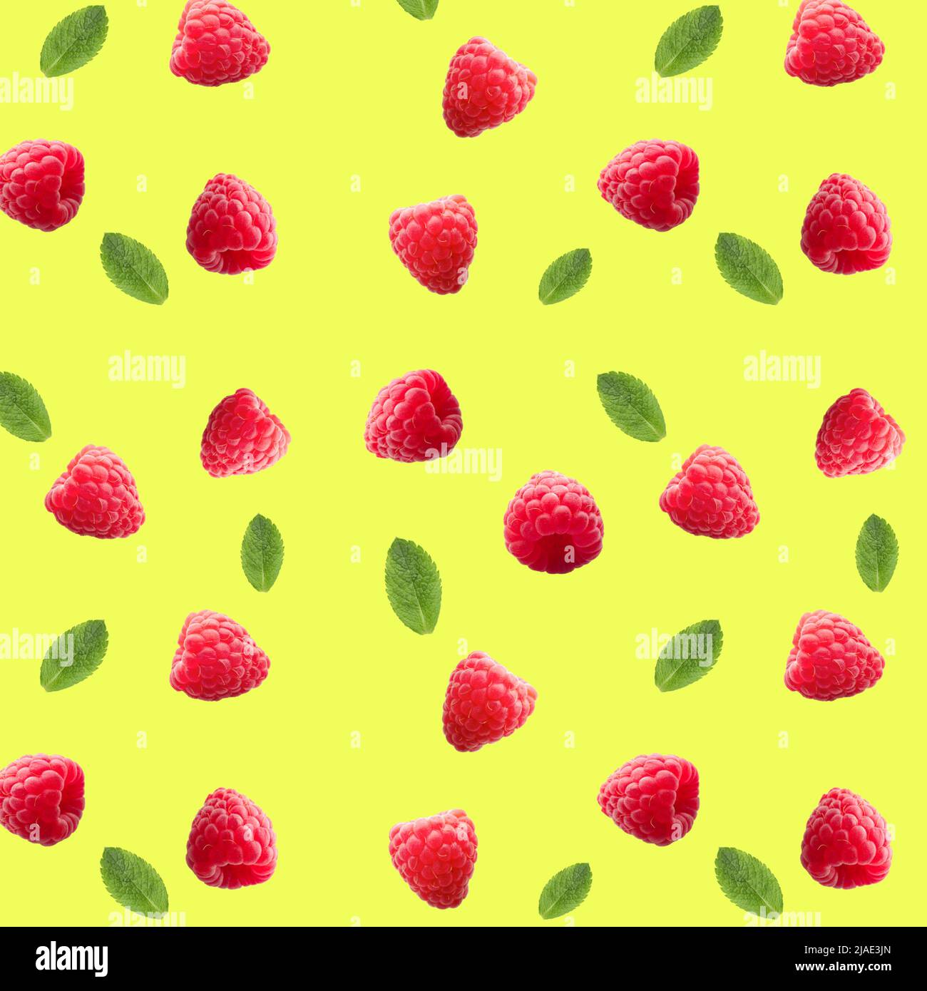 Many ripe raspberries and mint on yellow background. Pattern for design Stock Photo