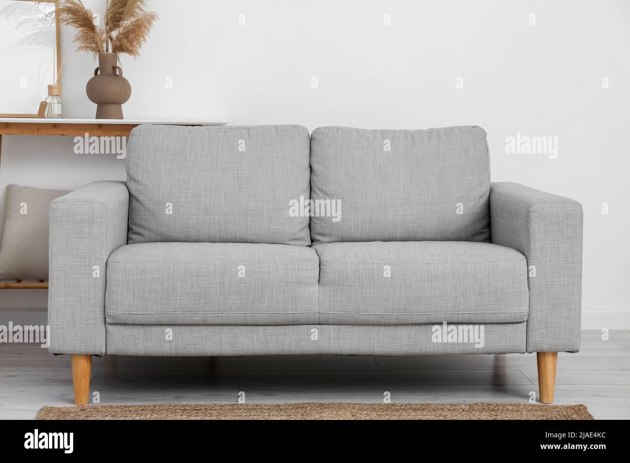 Interior of living room with grey sofa Stock Photo - Alamy