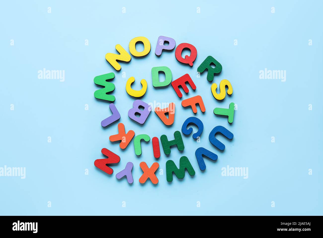 Colorful letters on blue background. Alphabet concept Stock Photo - Alamy