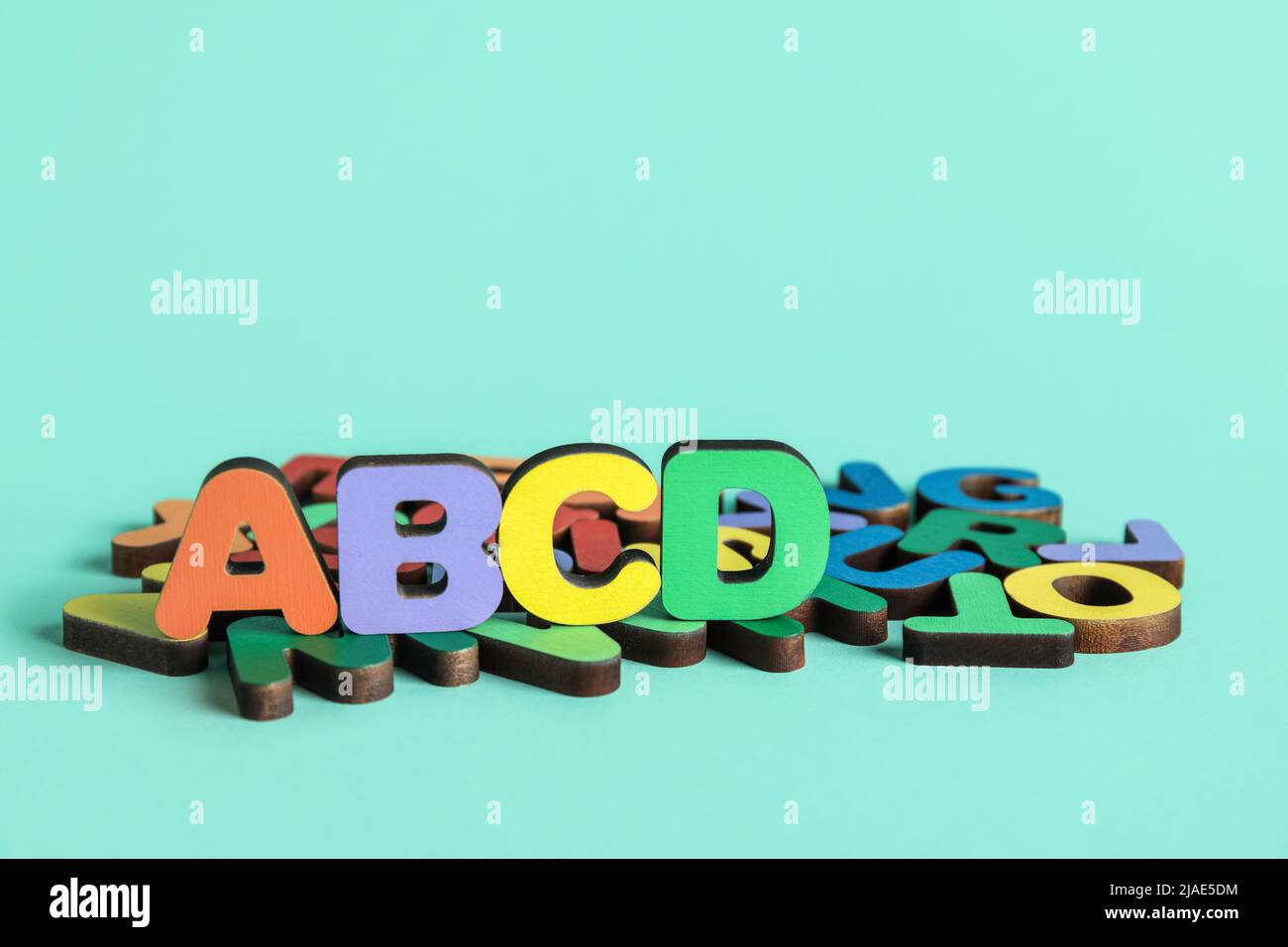 Colorful letters on blue background. Alphabet concept Stock Photo - Alamy