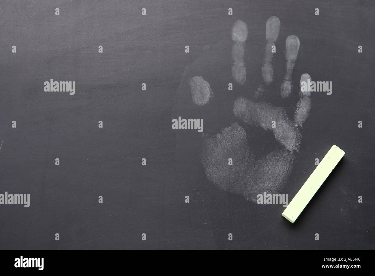 Handprint with chalk on school blackboard Stock Photo Alamy