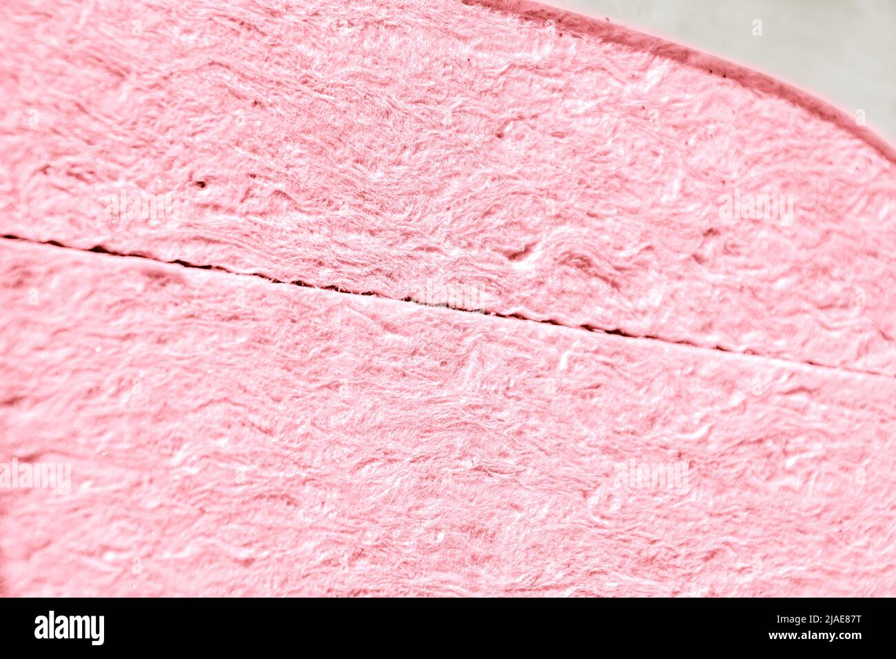 mineral wool or glass wool in pink or red color in package, selective focus Stock Photo