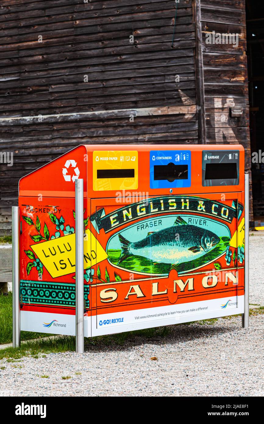 Recycling station decorated with a heritage tinned Salmon label from a former cannery in Steveston British Columbia Canada Stock Photo