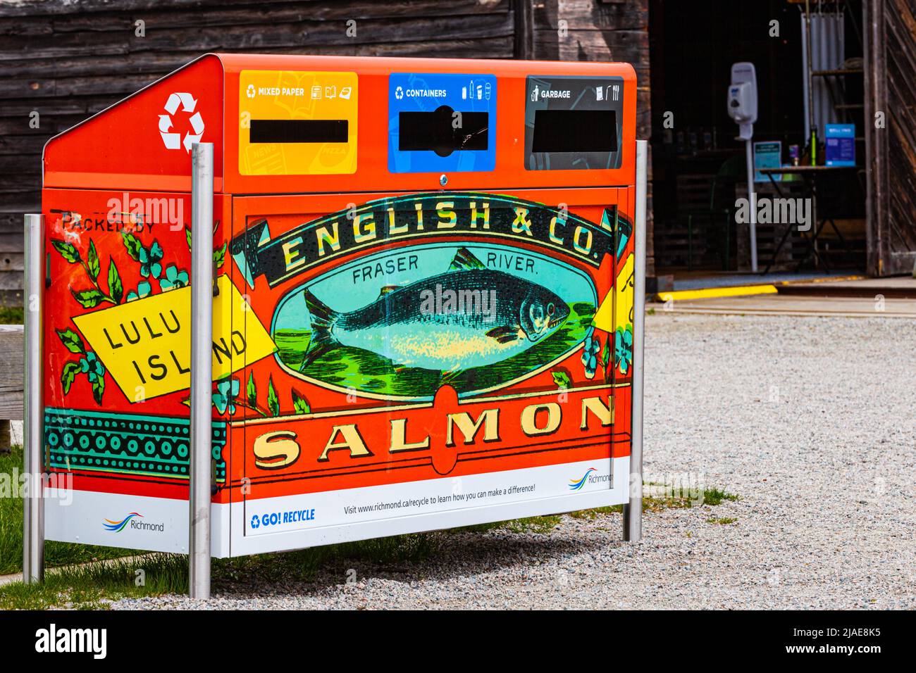 Recycling station decorated with a heritage tinned Salmon label from a former cannery in Steveston British Columbia Canada Stock Photo