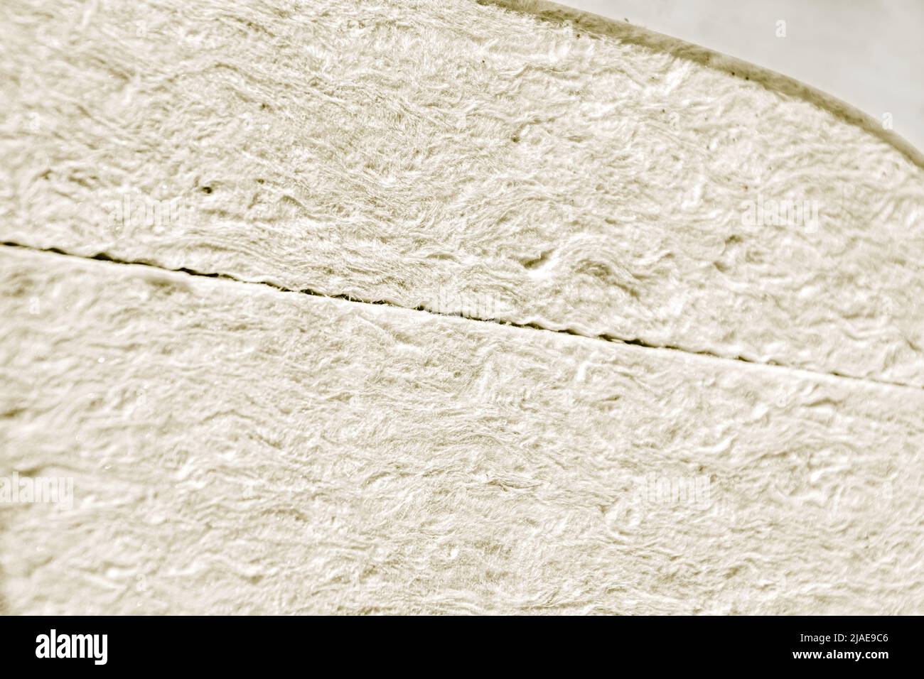 mineral wool or glass wool in white or cream color in package, selective focus Stock Photo