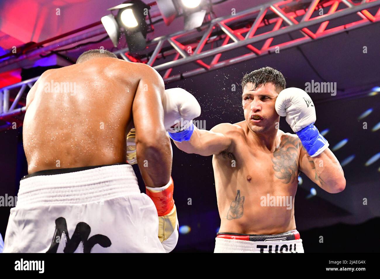 SAO PAULO, BRAZIL - May 29: (R-L) Cristian Fabian “El Tuca” Rios punches Esquiva Falcão in their super middleweight bout during Boxing For You 11 Event at Arena de Lutas on May 29, 2022 in São Paulo, SP, Brazil (Photo by Leandro Bernardes/Pximages) Credit: Px Images/Alamy Live News Stock Photo