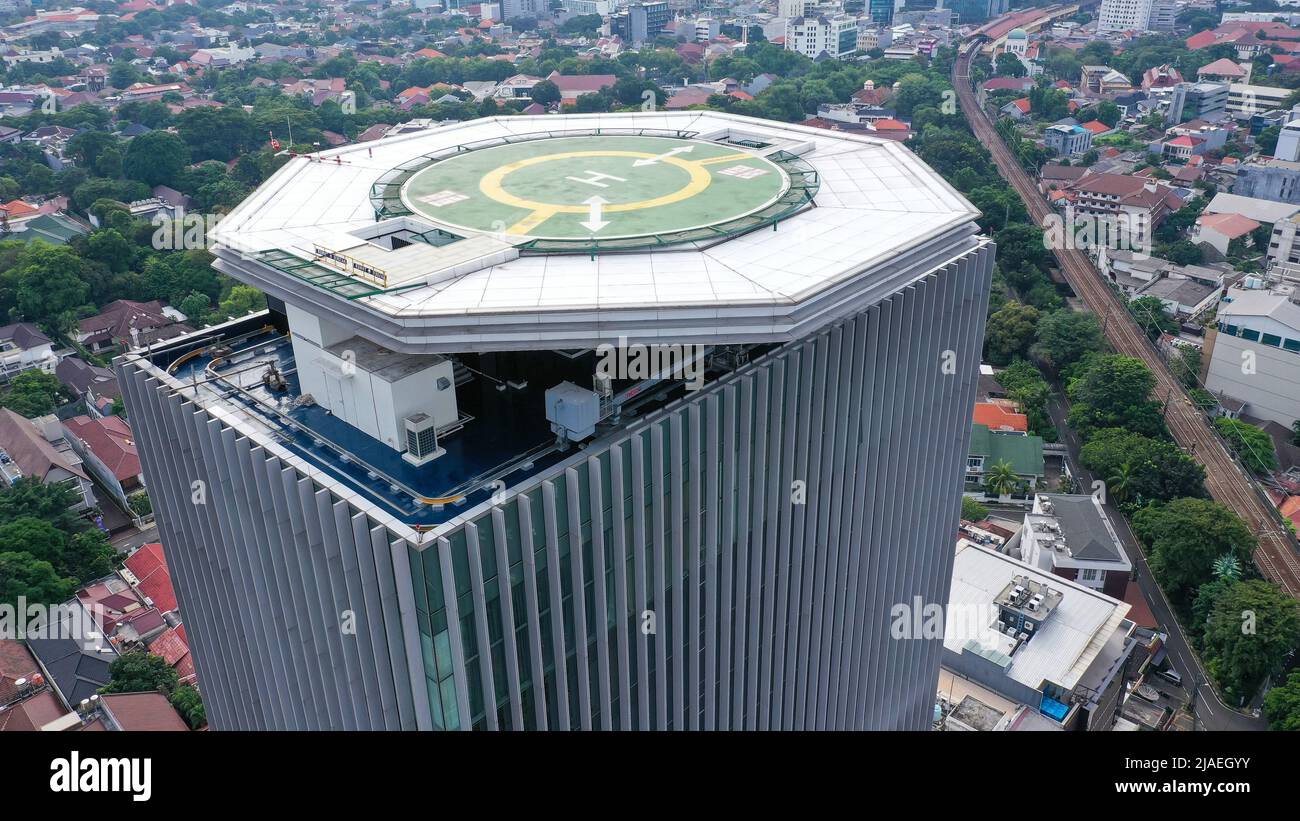 Aerial view of helipad. Helicopter landing pad on rooftop on skyscraper