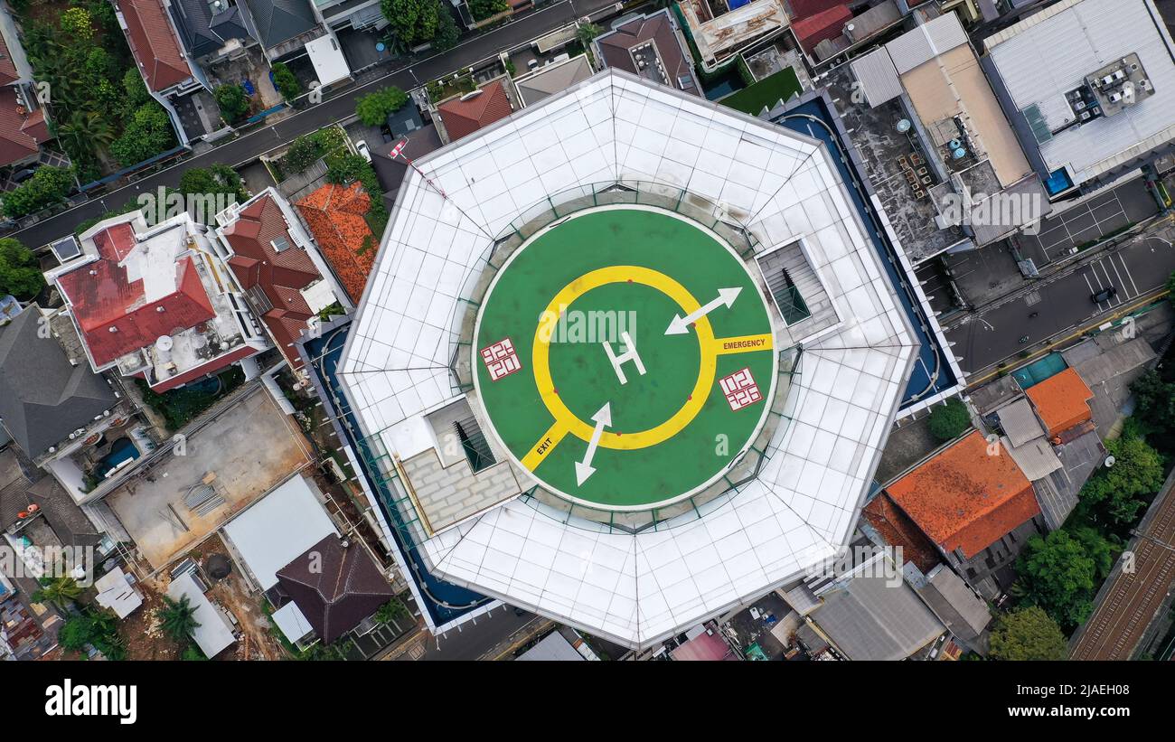Top down view of helicopter landing pad on the roof of modern