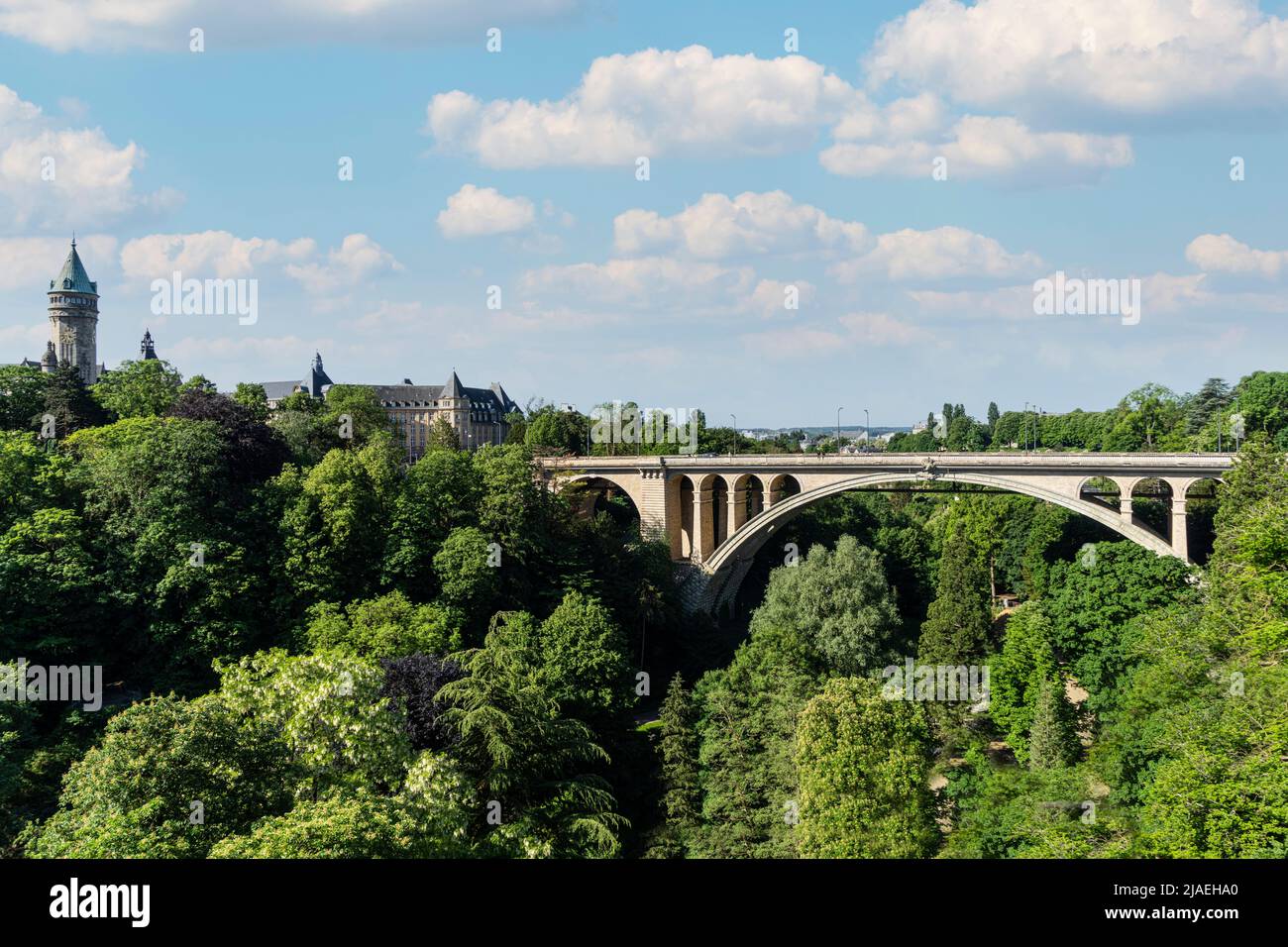 Luxembourg city, May 2022. Pont Adolphe. Stone bridge from the early 1900s with a picturesque view from above and a peaceful park at its foot. Stock Photo